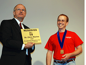 Dr. Booth presenting Dr. Marino with the Presidential Medallion Award.