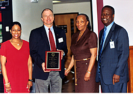 Dr. Ronnie Booth with award 